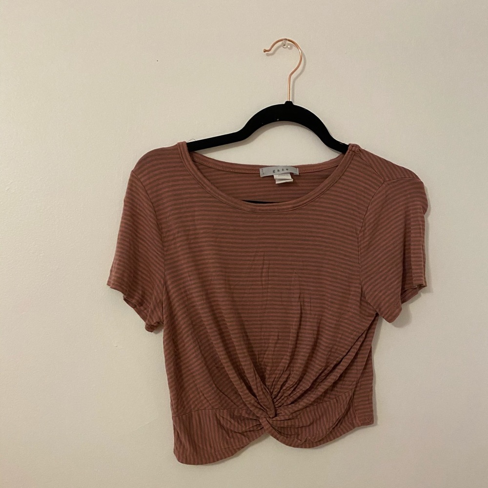 Loose, stripped crop top with cross- cross